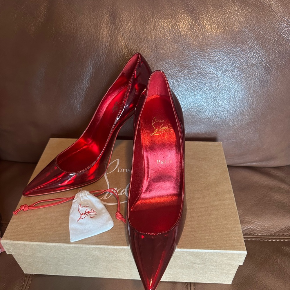 Christian Louboutin patent leather red pumps